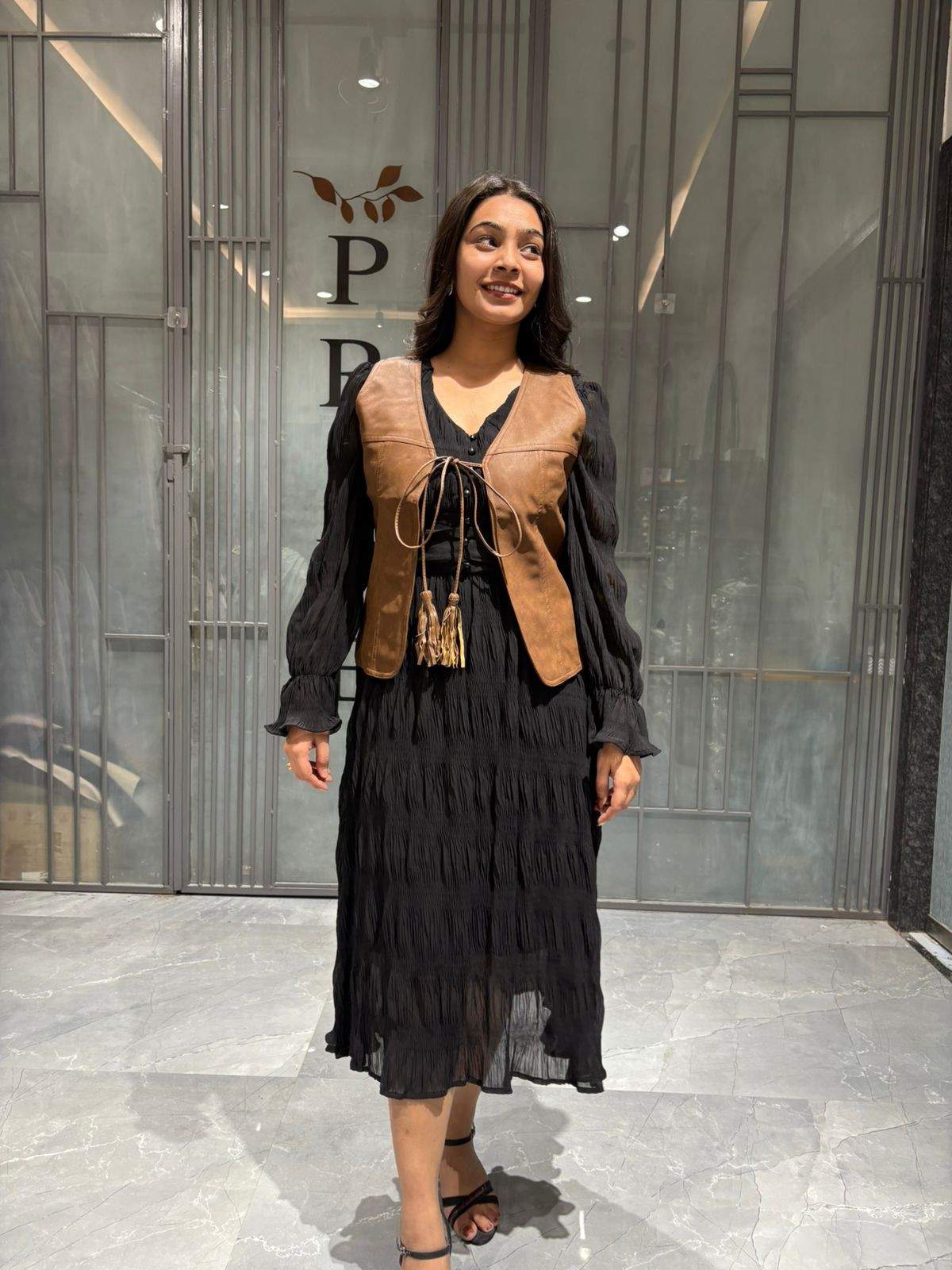 Black midi dress with leather jacket